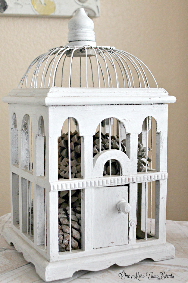 White-Bird-house-filled-with-pinecones-for-a-inexpensive-Winter-setting